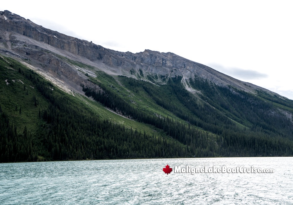 Calm Maligne Lake by Mountain Shoreline