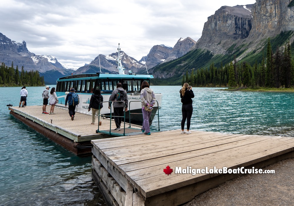 Visitors Boarding Maligne Boat Cruise in front of Hall of Gods